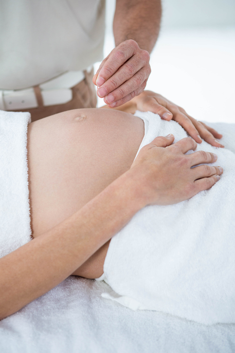 Pregnant woman in an acupuncture therapy